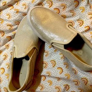 White opalescent slip on Vans shoes